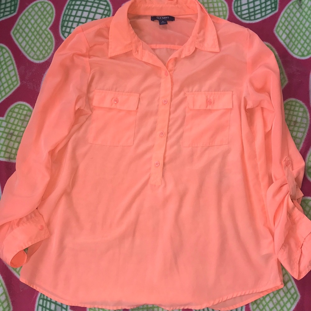 A pink top button down shirt